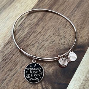 Alex and Ani Harry Potter bracelet in a shiny rose gold finish.